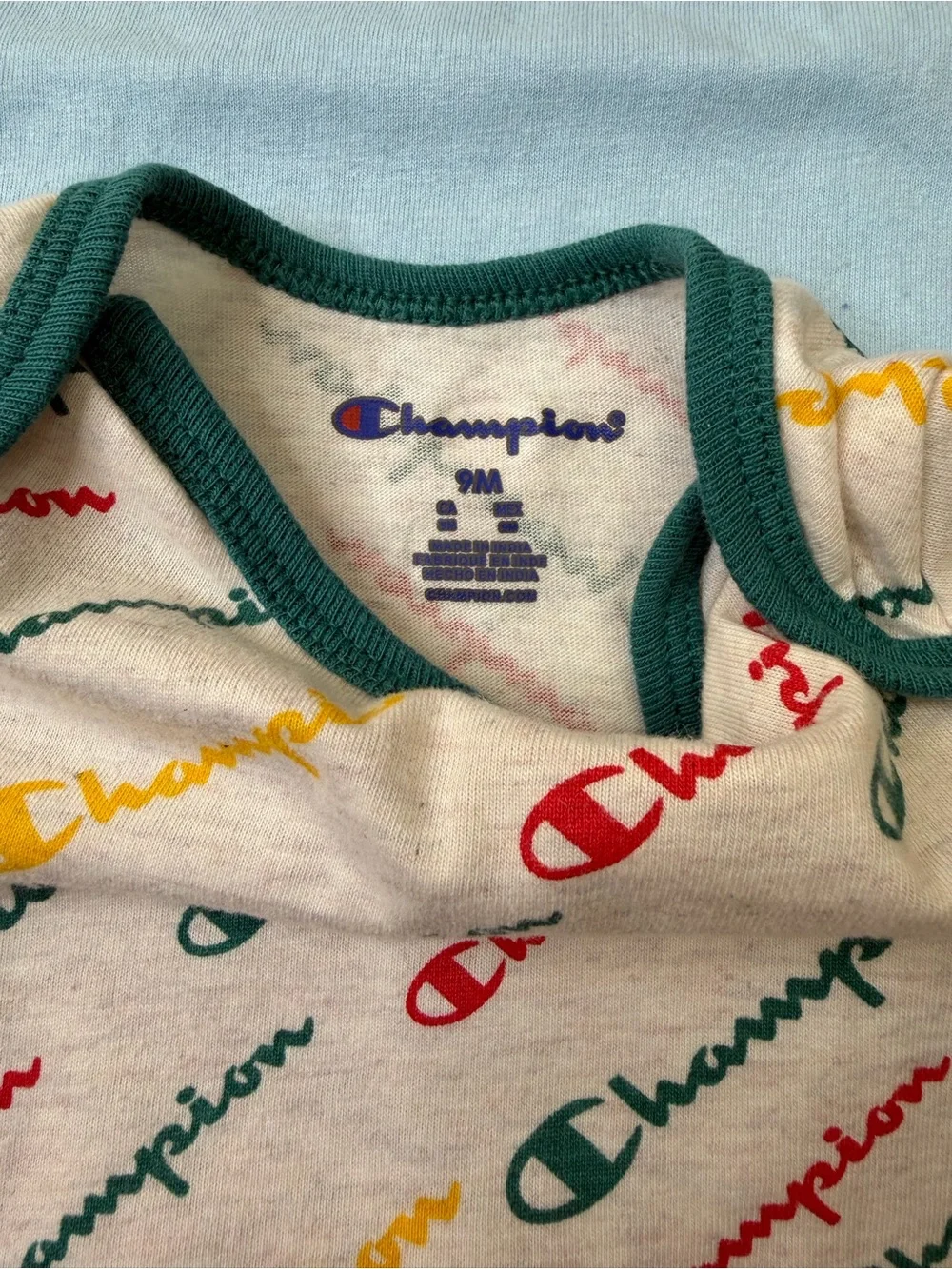 Champion 4-piece baby bodysuit bundle in size 6-9 months/9 months